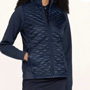 Puma woman’s navy quilted cloudsspun  wt prima-loft insulation jacket. NWT